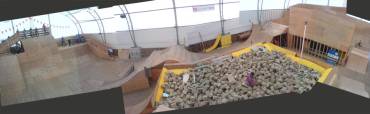 Panorama of the Whistler AirDome - showing the 30ft roll-in on the left, foam pit in the centre, various step-up jumps, and vert walls on right.