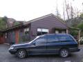 1991 Subaru Legacy 4x4 tour vehicle in front of the house in Bills Way, Wanaka