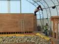 Tom arching a backflip from the big drop-off into the foam pit
