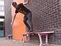 Spal grinding the pink, styling out a backside smith on the Portsmouth University benches